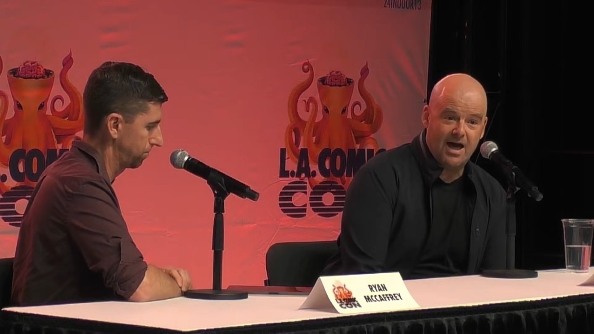 Ryan McCaffrey sat next to Dan Houser at a table.