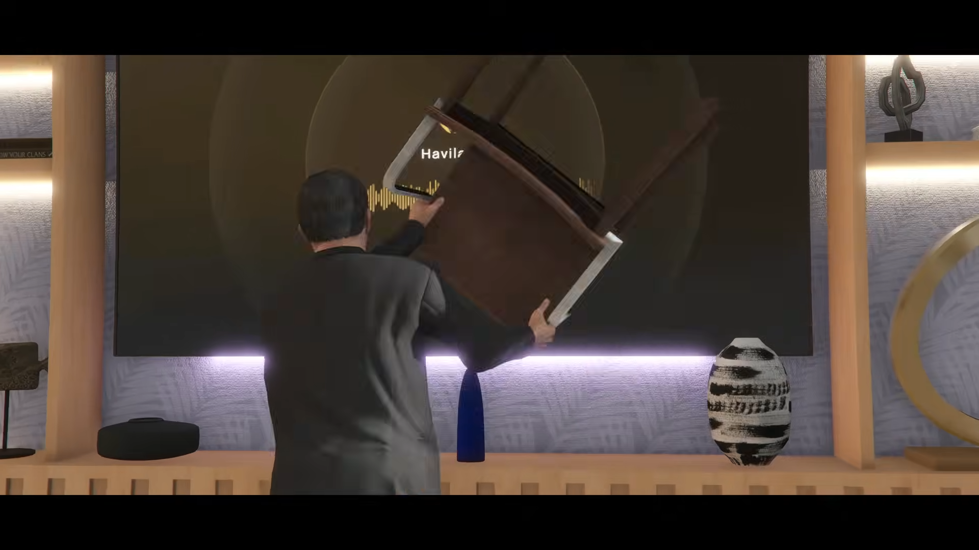 Michael De Santa smashing a TV with a chair.