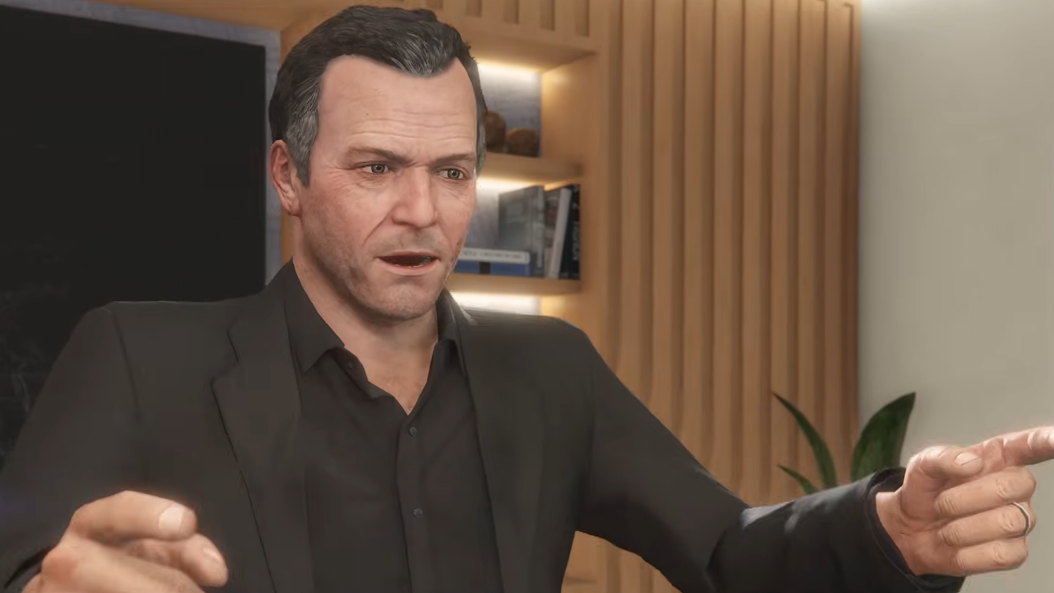 An older Michael De Santa pointing both hands towards the camera as part of the new GTA Online update.