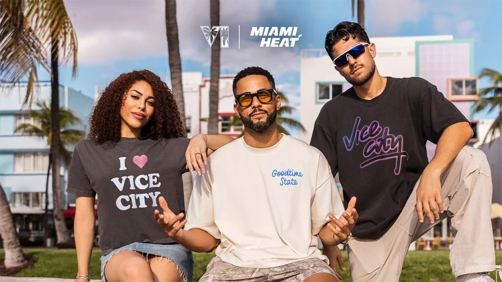 New GTA 6 x Miami Heat Merchandise Announced GTA 6 vice city collection x miami heat merch. Three people stand in front of palm trees wearing various vice city clothing items.