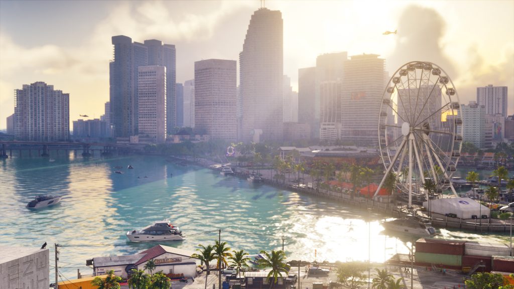 A waterfront view of Vice City featuring skyscrapers along the bay, boats traveling across the water, and a large Ferris wheel at a marina in Grand Theft Auto VI.